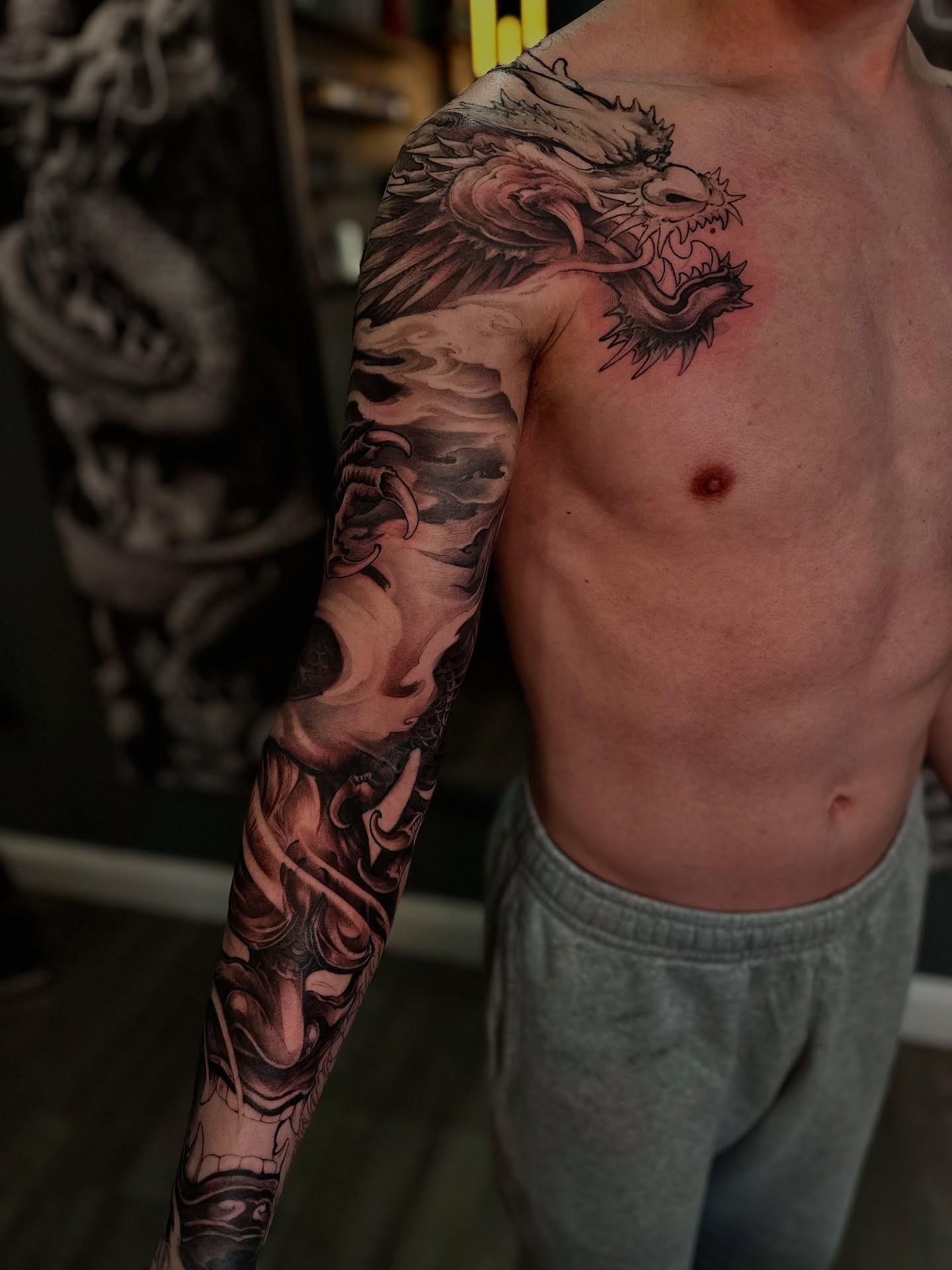 Dragon realism tattoo on the upper arm by Thien Phan