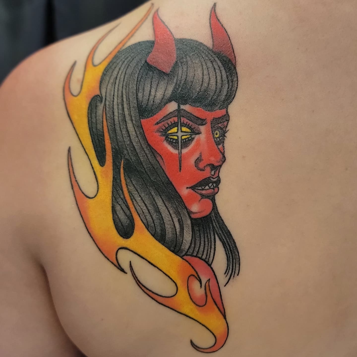 Flame-wrapped devil American traditional tattoo on the shoulder by Lizz Zonno, Naperville, Illinois