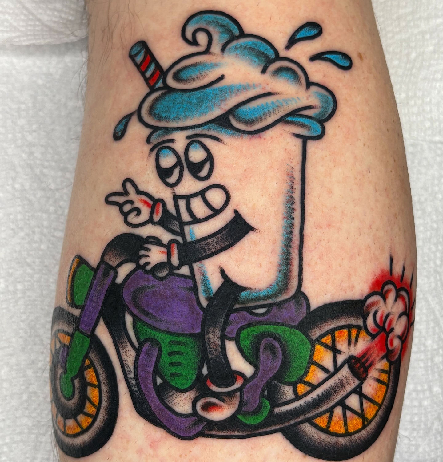 Cartoon character riding motorcycle American traditional tattoo on the forearm by ✨ Gabi ✨