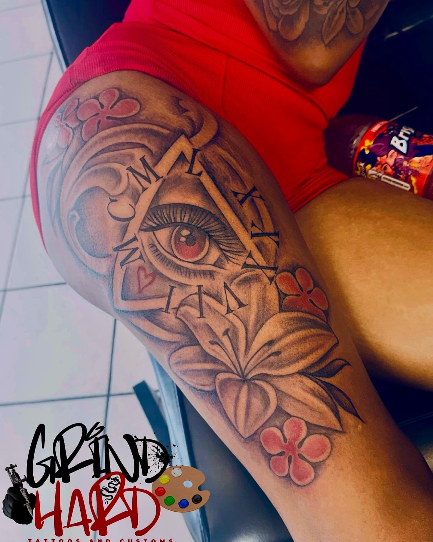 Eye and flowers American traditional tattoo on the forearm by GrindHard Quen