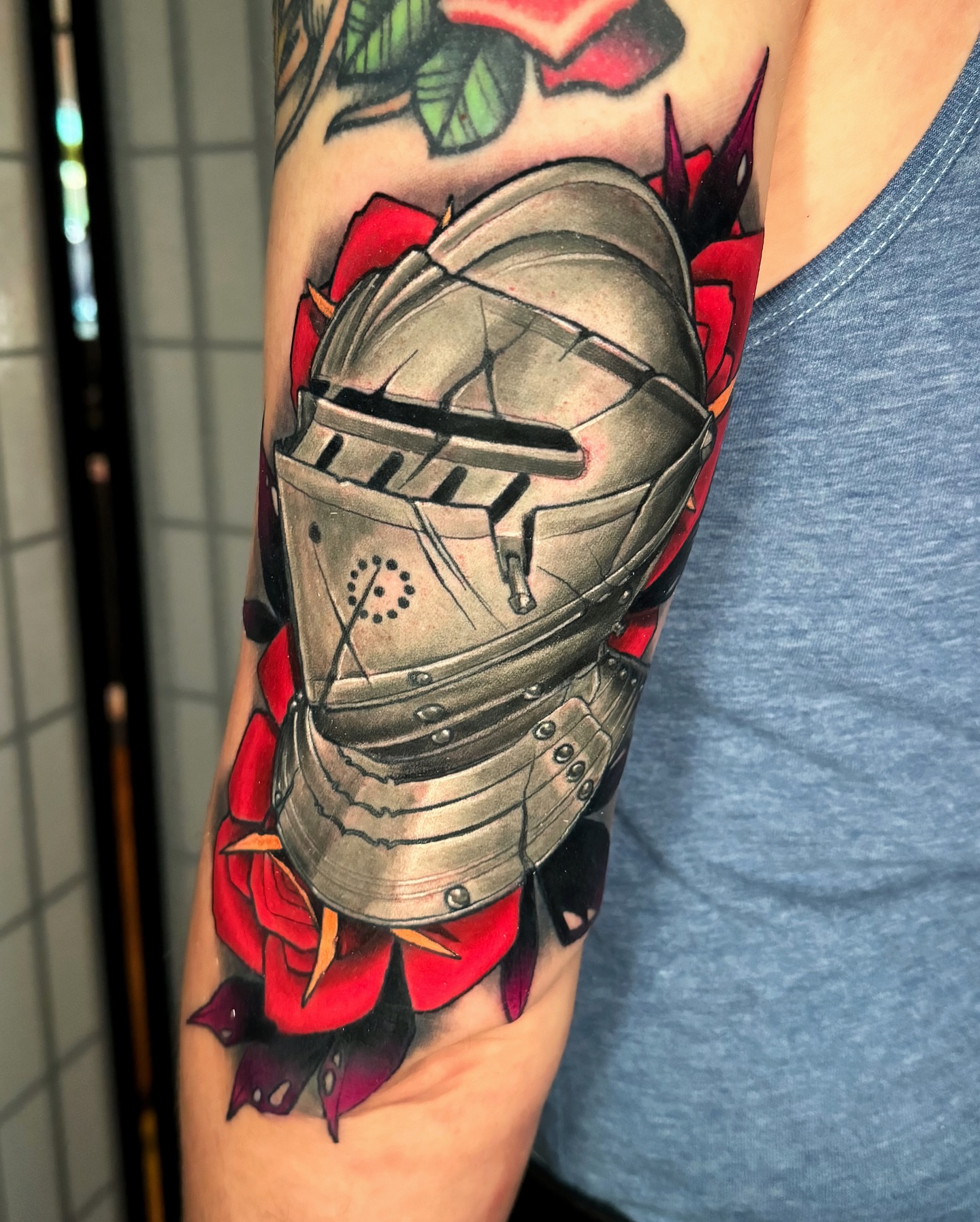 Knight armor and roses American traditional tattoo on the forearm by Austin Britt