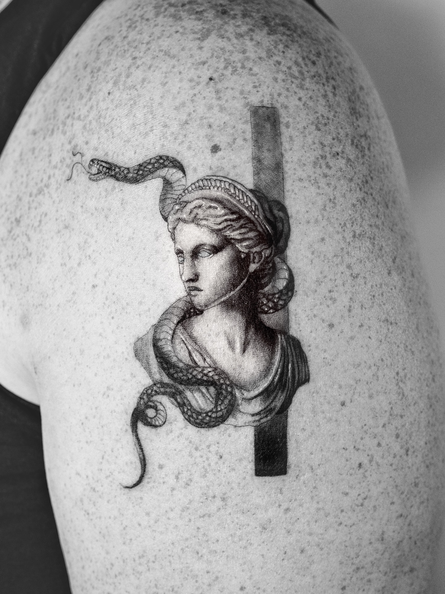 Medusa bust realism tattoo on the shoulder by Ross Clark Tattoos