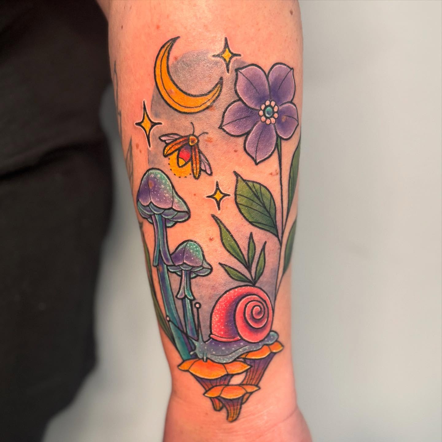 Mushroom, snail, flower, moth, crescent moon new school tattoo on the forearm by Ashley Rose - Minnesota Tattoo Artist