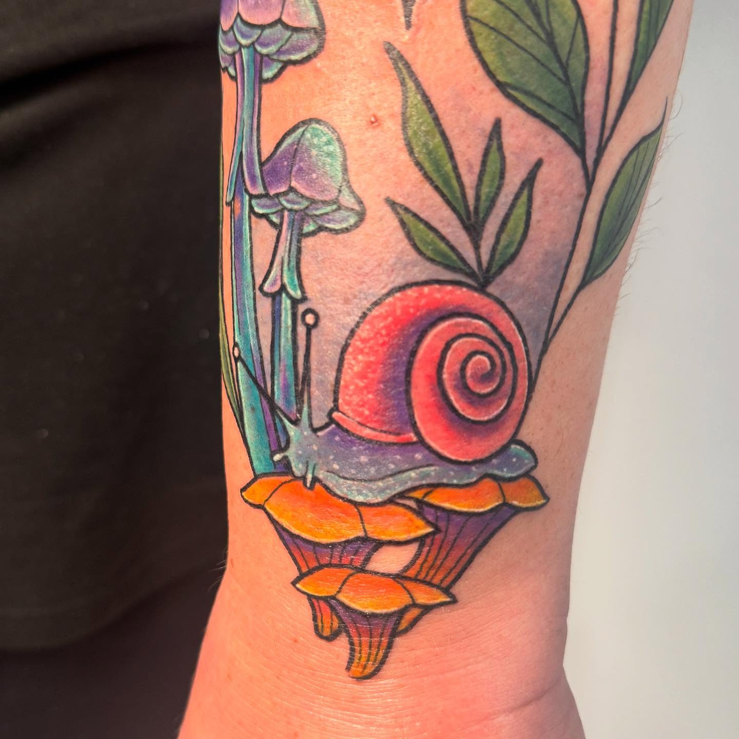 Snail and mushrooms new school tattoo on the forearm by Ashley Rose - Minnesota Tattoo Artist