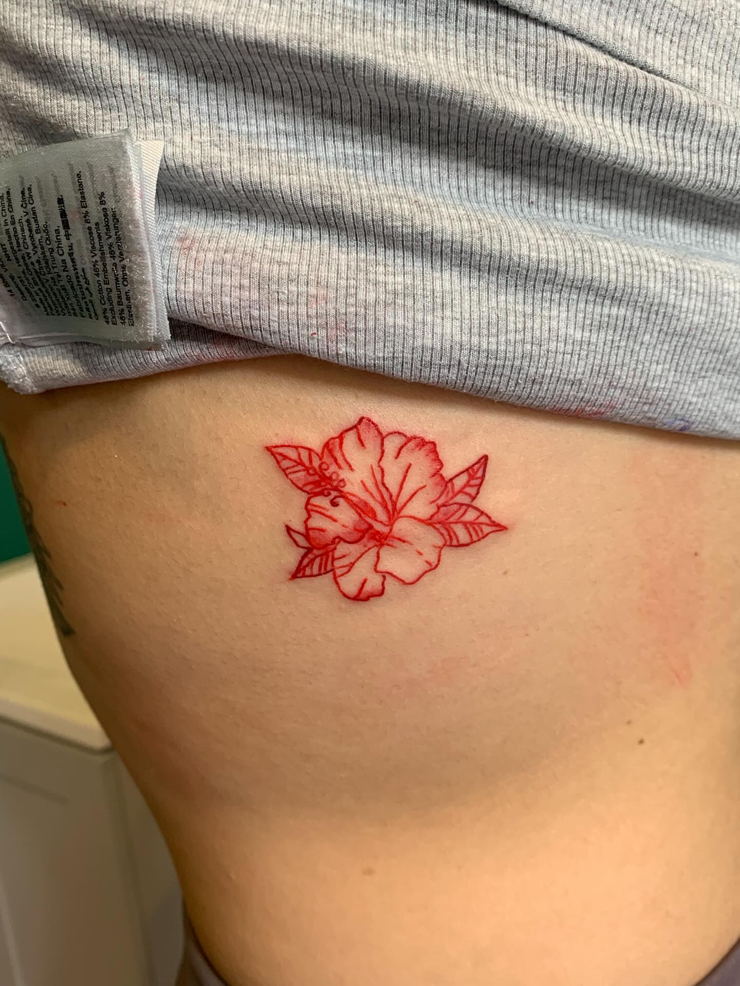 Hibiscus flower dotwork tattoo on the thigh by ellie