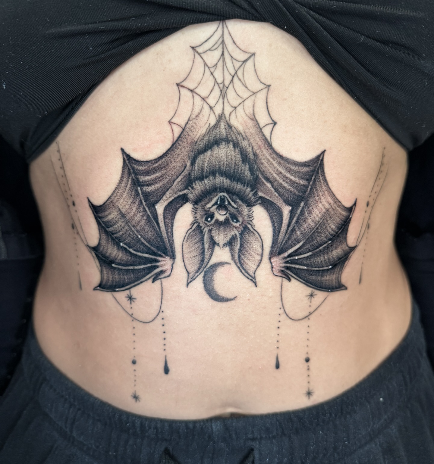 Bat geometric tattoo on the torso by Gabah🌹