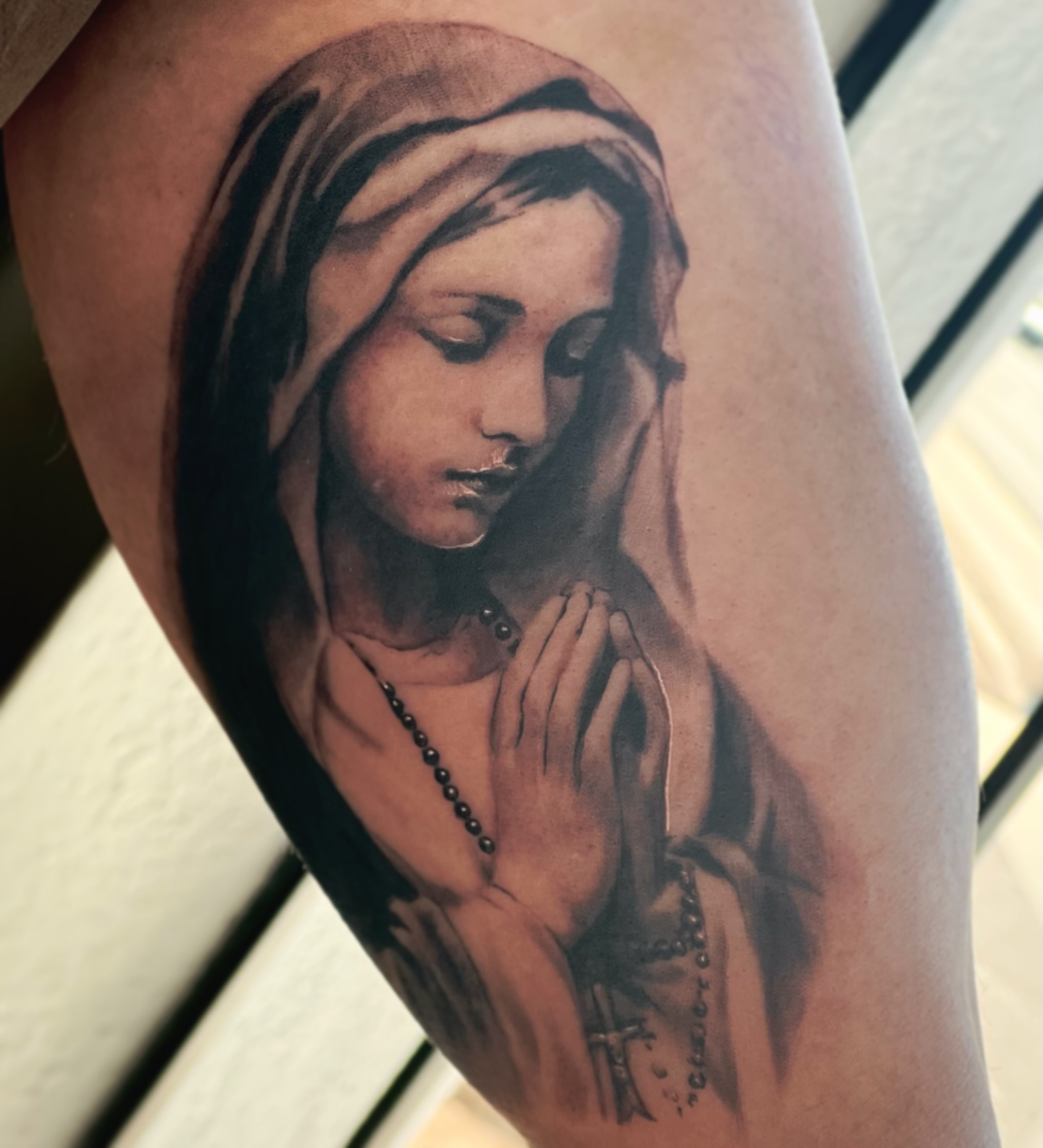 Praying woman realism tattoo on the forearm by Jordan