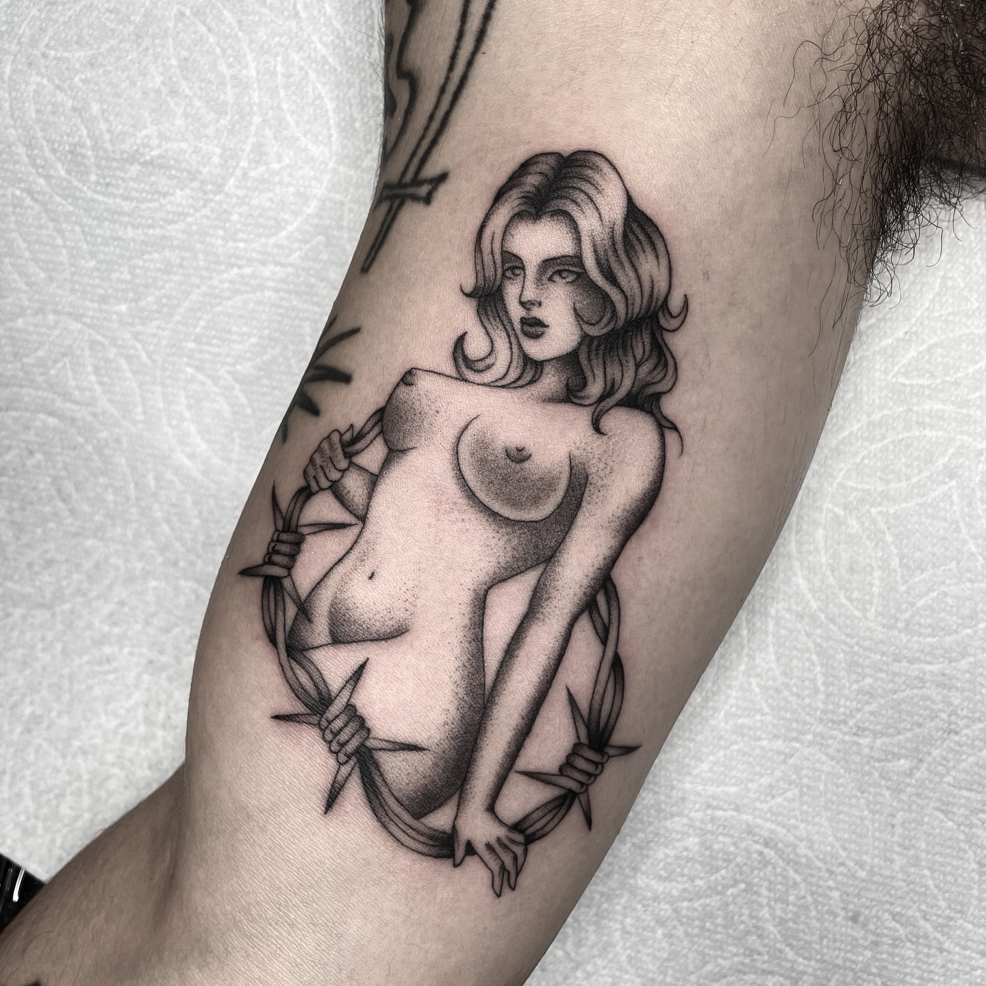 Nude woman dotwork tattoo on the forearm by Dakota Jenner