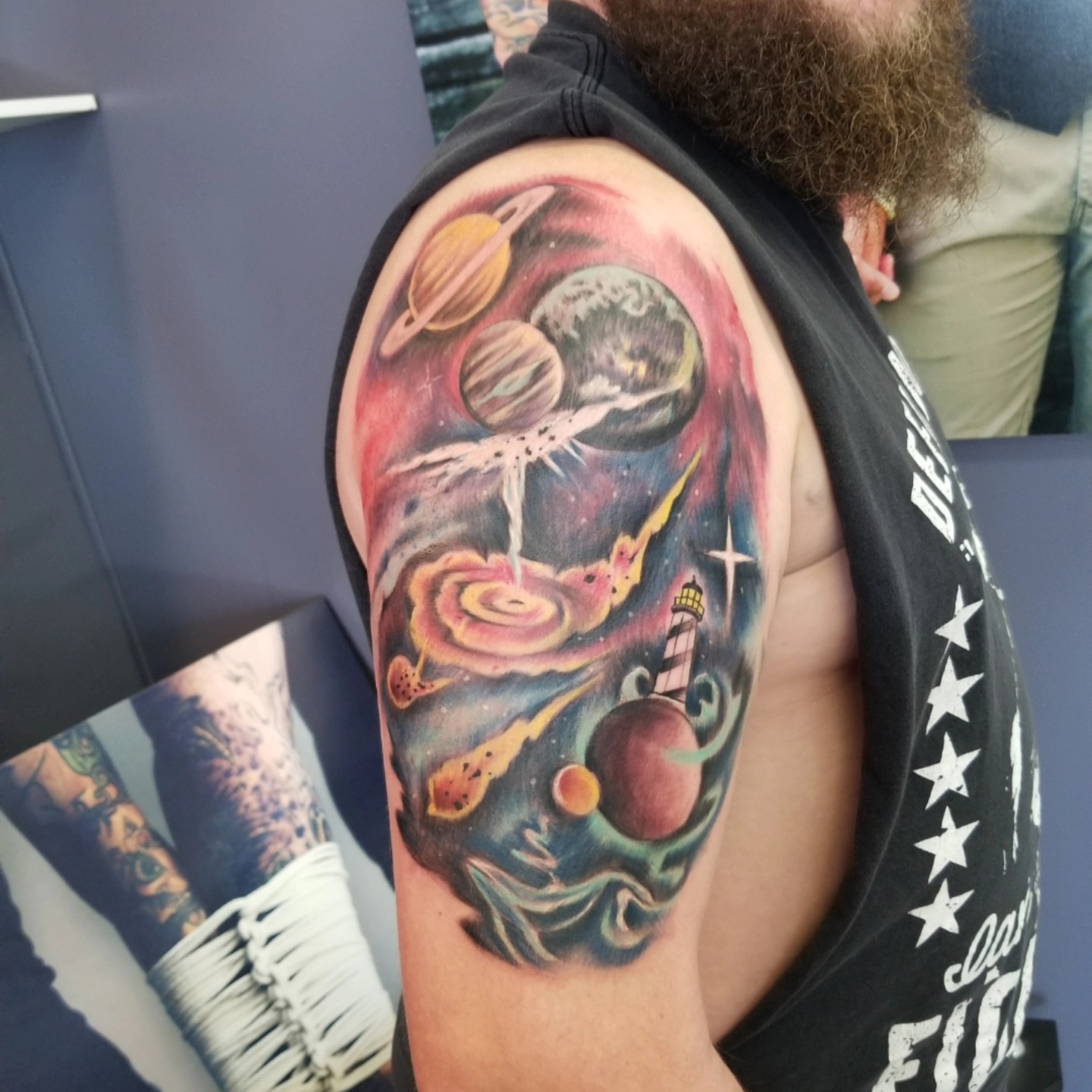 Space scene realism tattoo on the shoulder by Dennis Foust