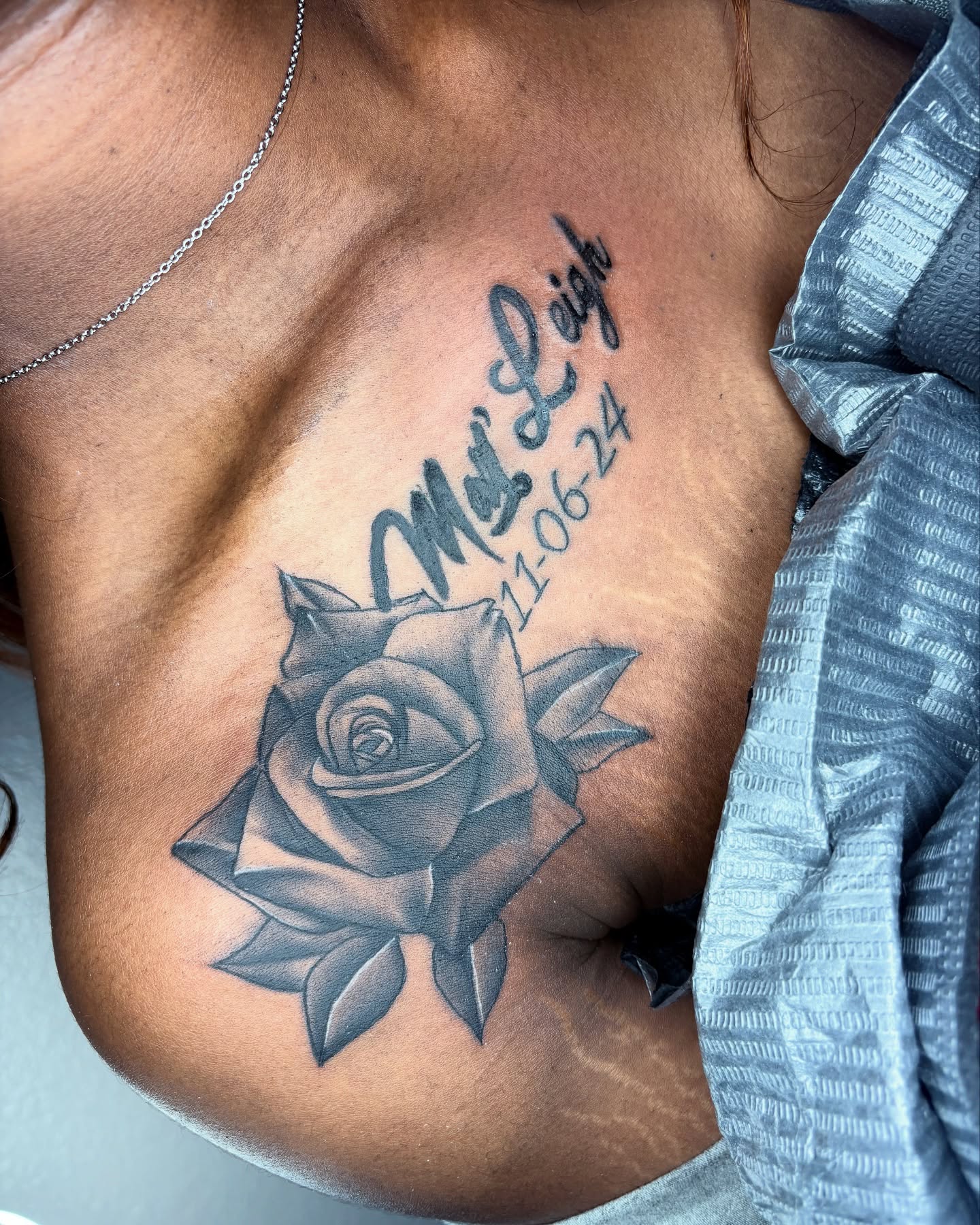 Rose black and grey tattoo on the chest by Maleek Inkz