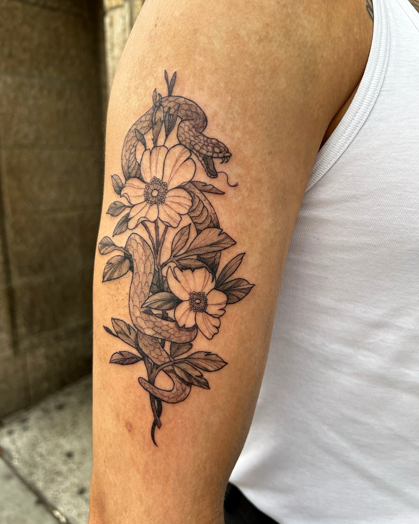 Snake and flowers black and grey tattoo on the forearm by ππ²π§π§ ππ’π₯πππ« (π©π¦