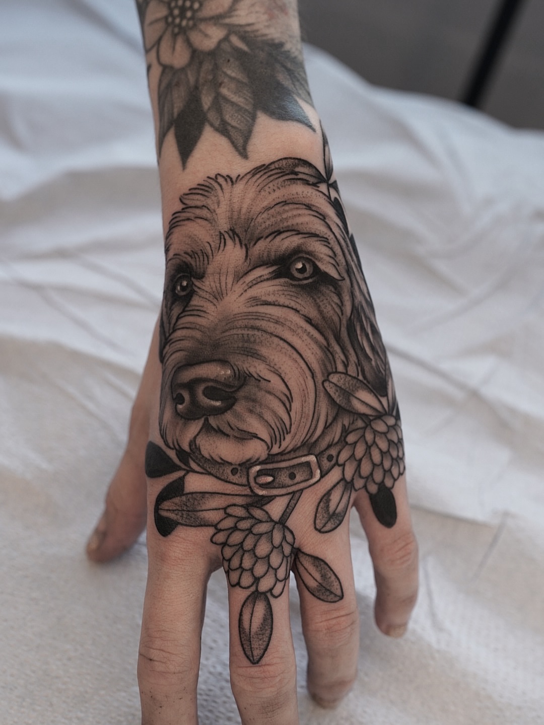 Dog head realism tattoo on the hand by Kyle Stacher - Blackwork Tattoos - Denver