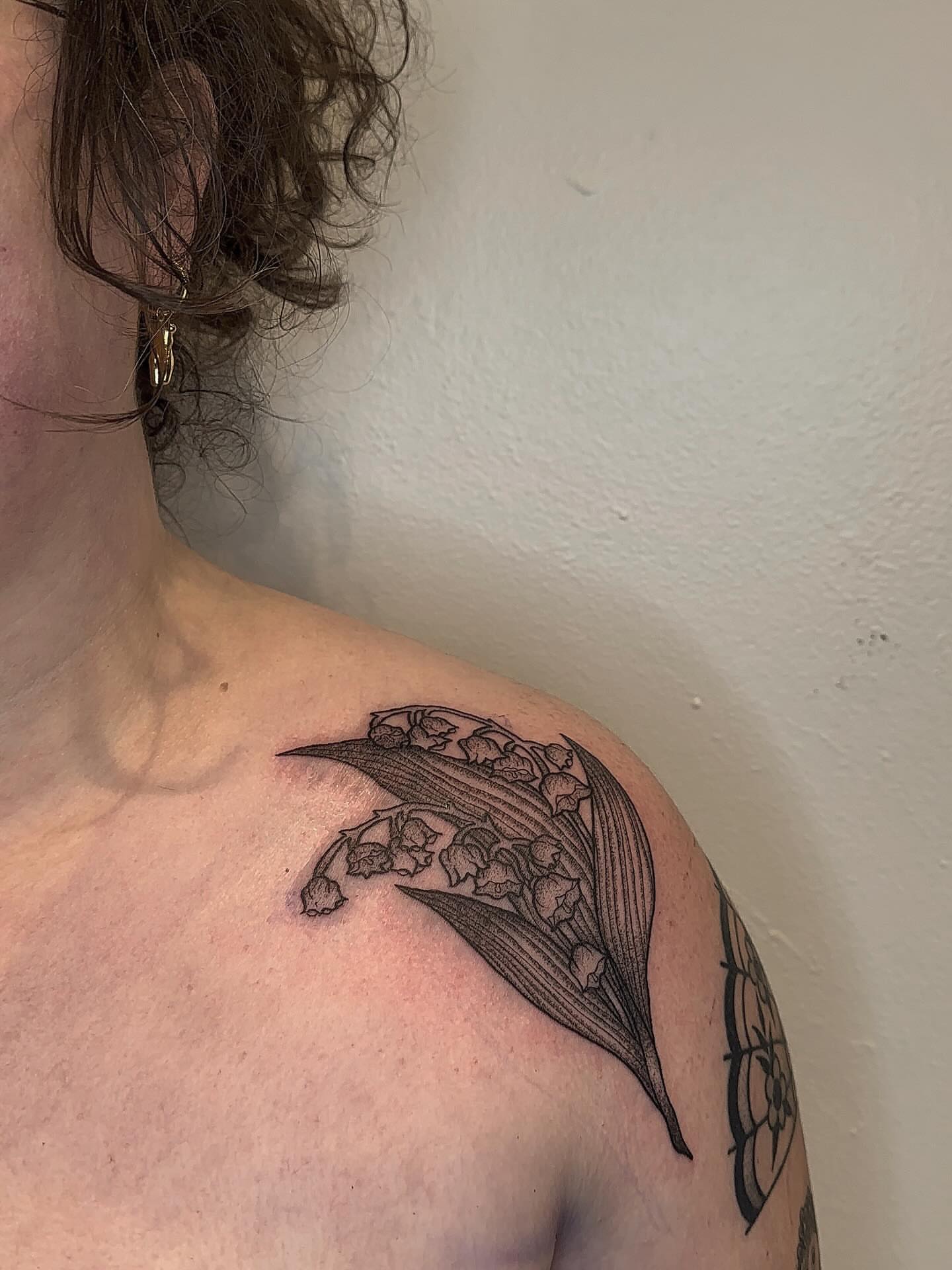 Lily of the valley black and grey tattoo on the shoulder by savannah ★ ( previously feralratbabe )