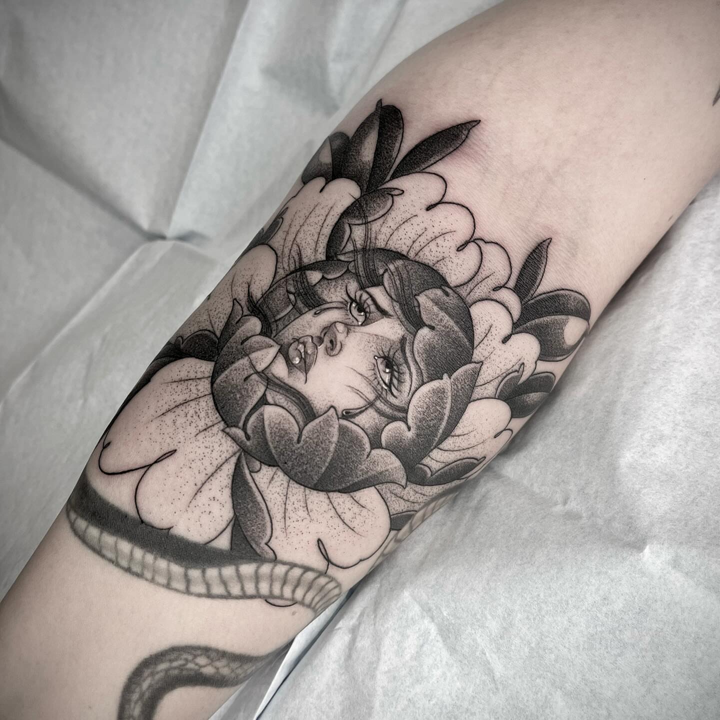 Woman with flowers dotwork tattoo on the forearm by Martha Gual π€ East ATX Tattooer