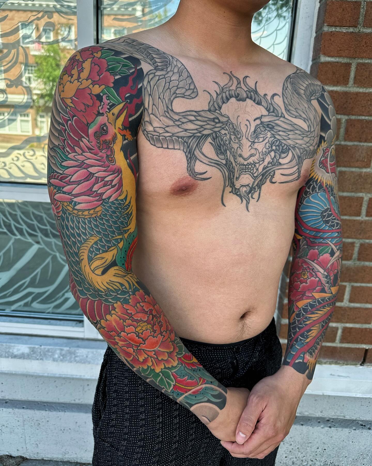 Dragon and phoenix japanese irezumi tattoo on the torso by Xiaojun Yin, Vancouver, British Columbia
