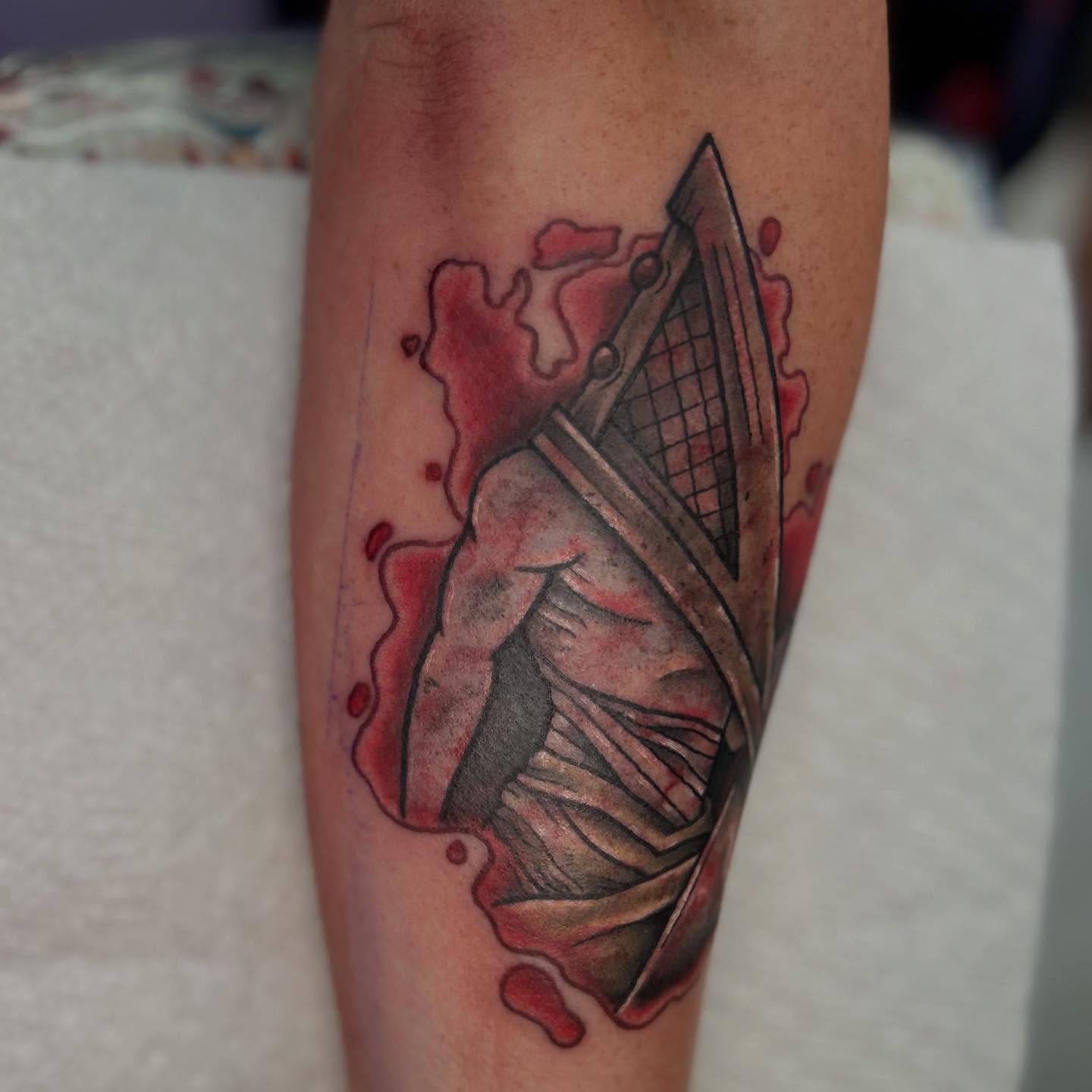 Pyramid head dark realism tattoo on the forearm by Abby Watts, Columbus, Ohio