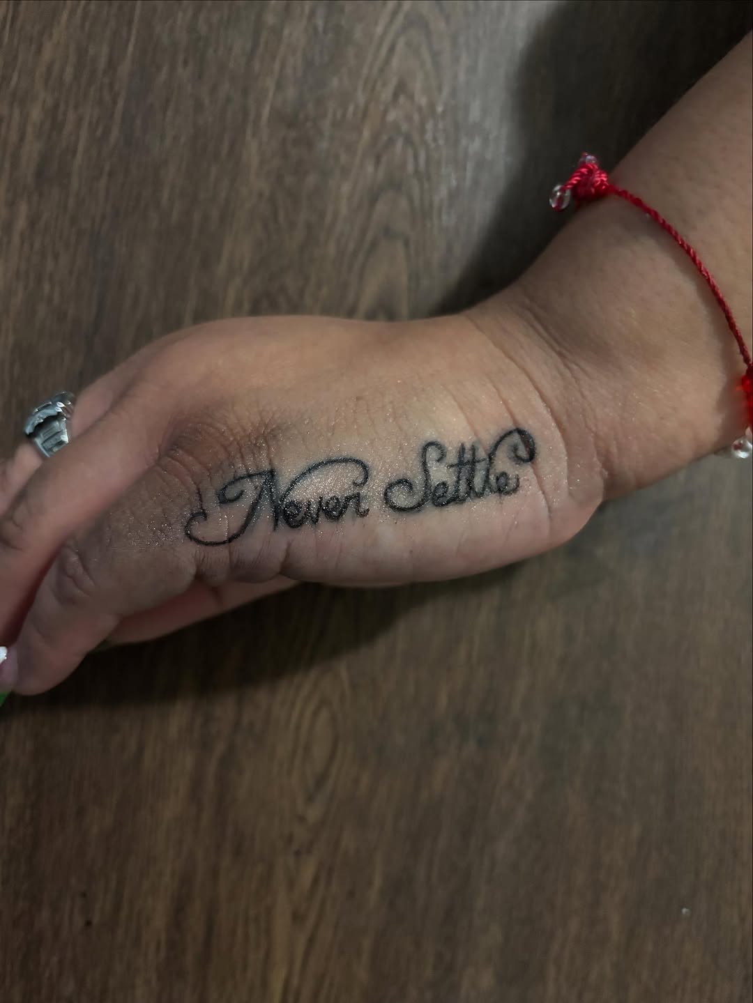Script lettering lettering tattoo on the hand by Ink_ Hustle36