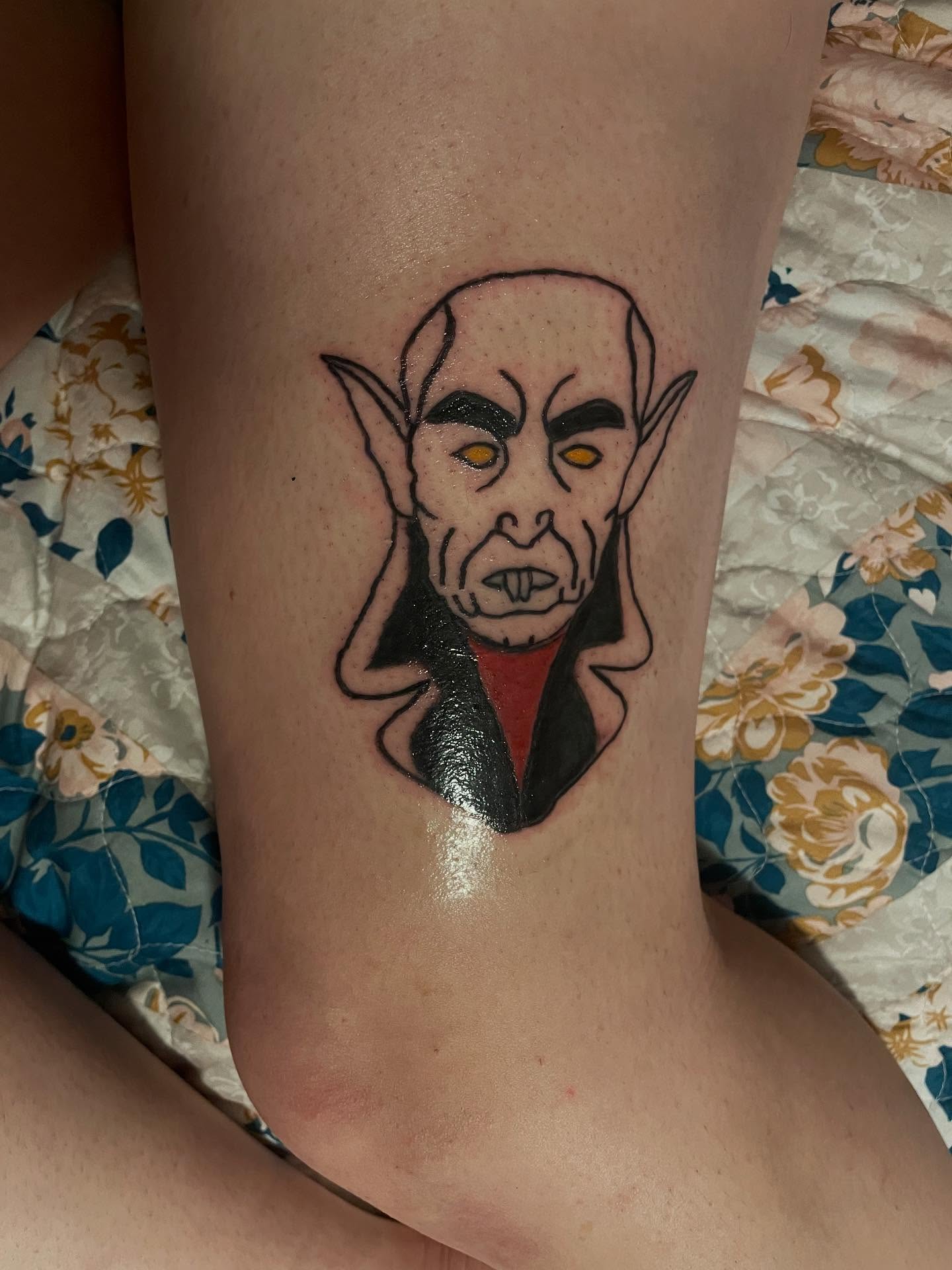 Vampire black and grey tattoo on the thigh by Madison