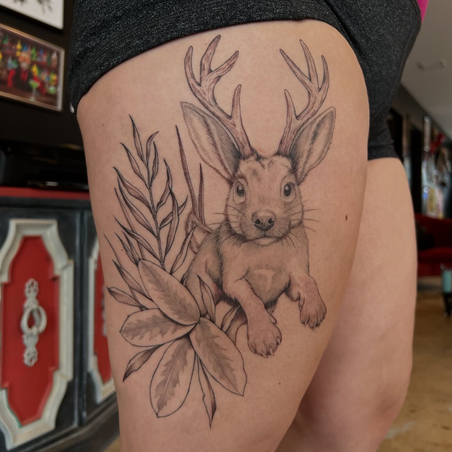 Deer with antlers realism tattoo on the thigh by Dom