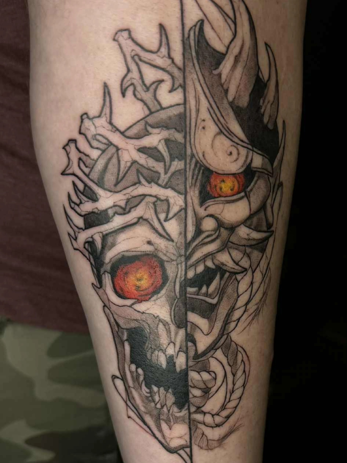 Skull with horns dark realism tattoo on the forearm by Marquis Neal