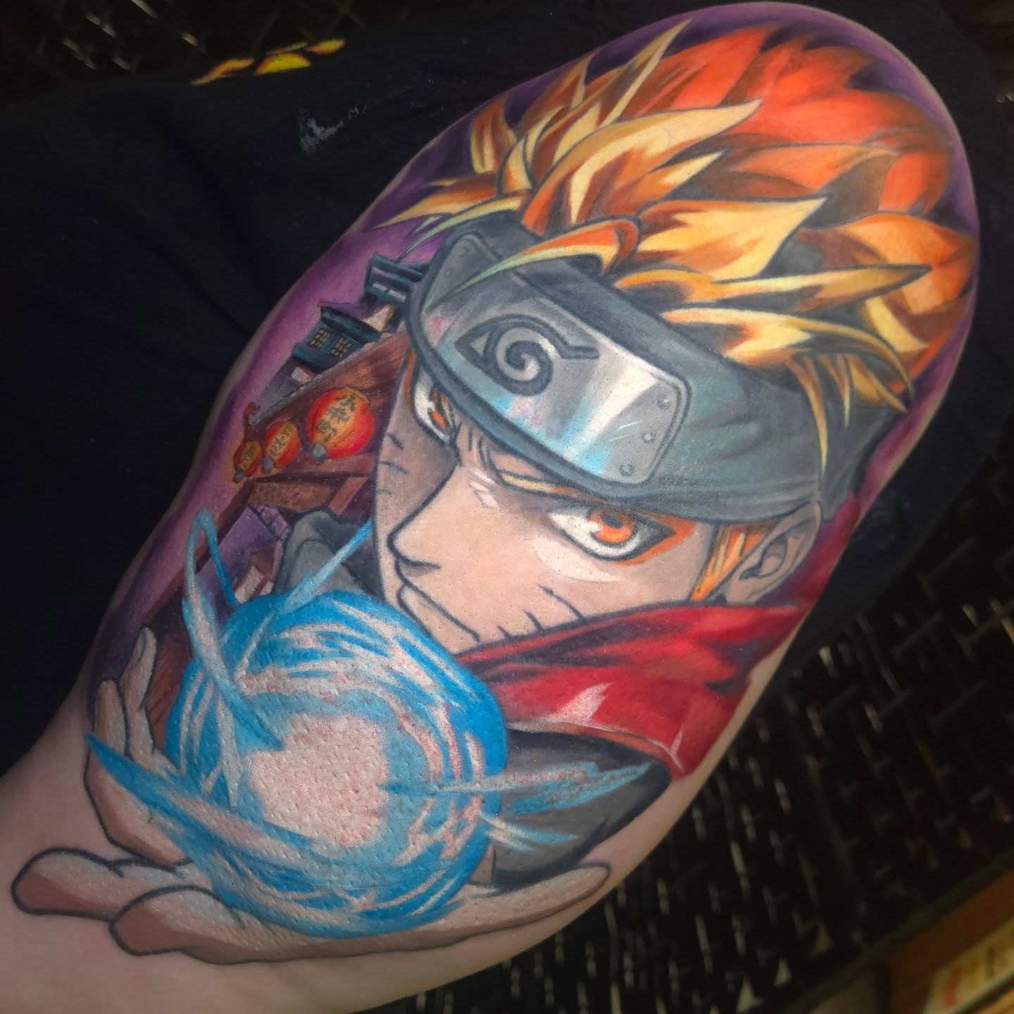 Anime character anime tattoo on the upper arm by Nic Mann
