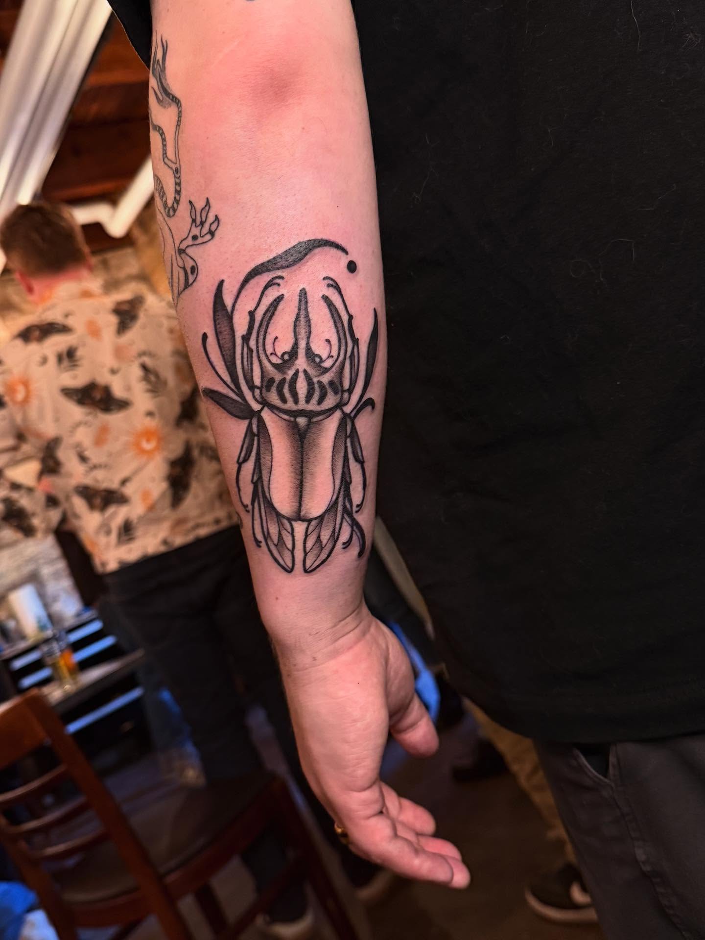 Squid black and grey tattoo on the forearm by Jessica Haug