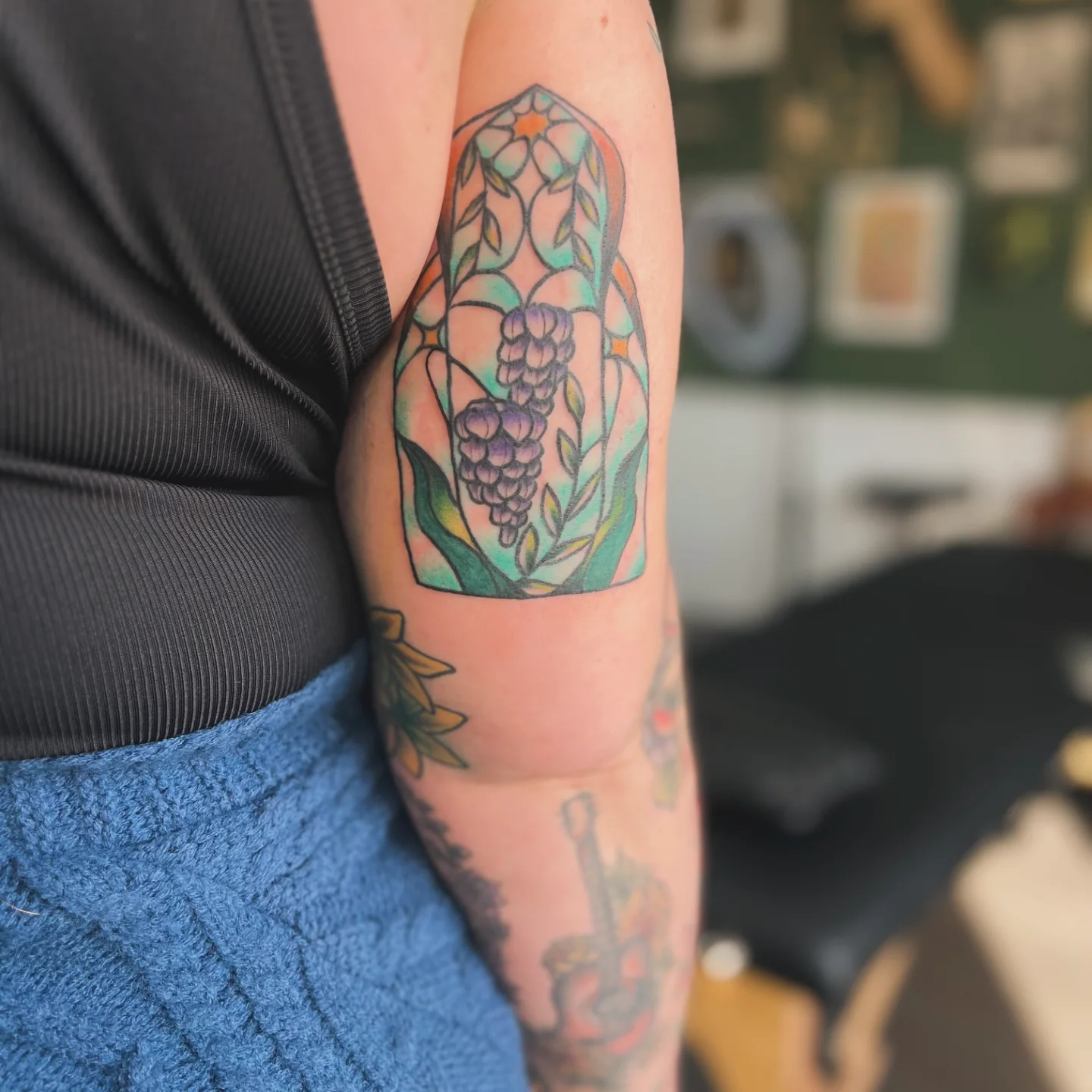 Grape cluster geometric tattoo on the forearm by Luna Faye