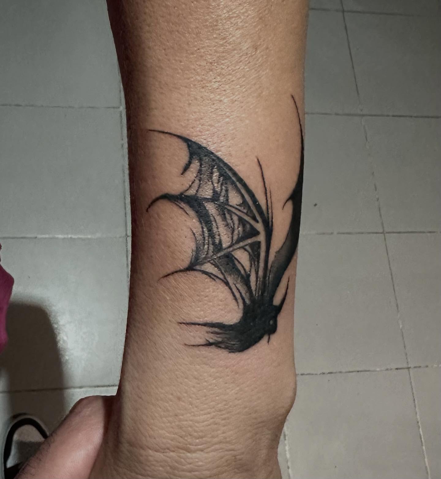 Bat black and grey tattoo on the forearm by Kunaytattoo