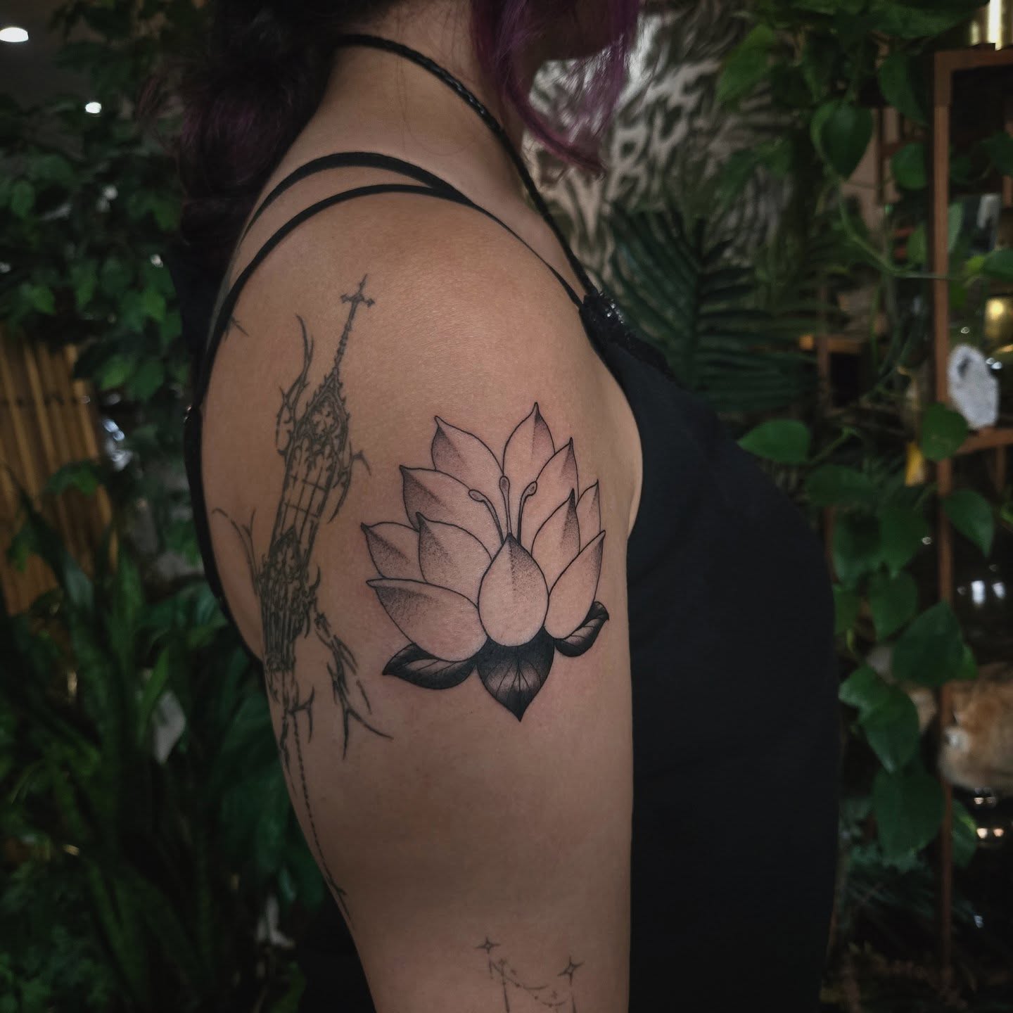Lotus flower dotwork tattoo on the shoulder by Alexandra Colella ✨️