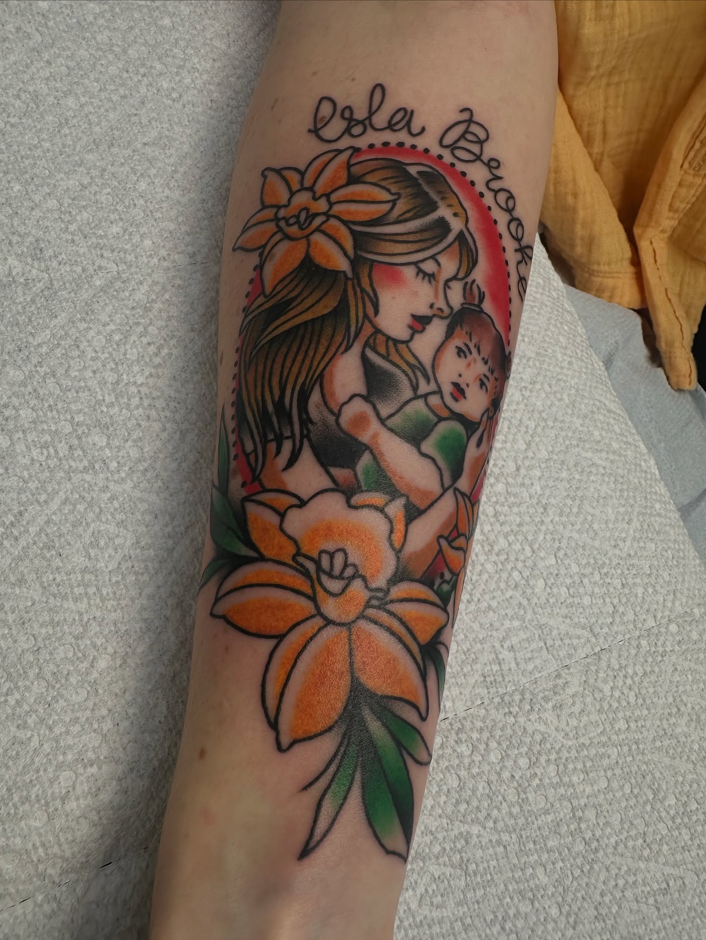 Mother and child American traditional tattoo on the forearm by Heather Cherish