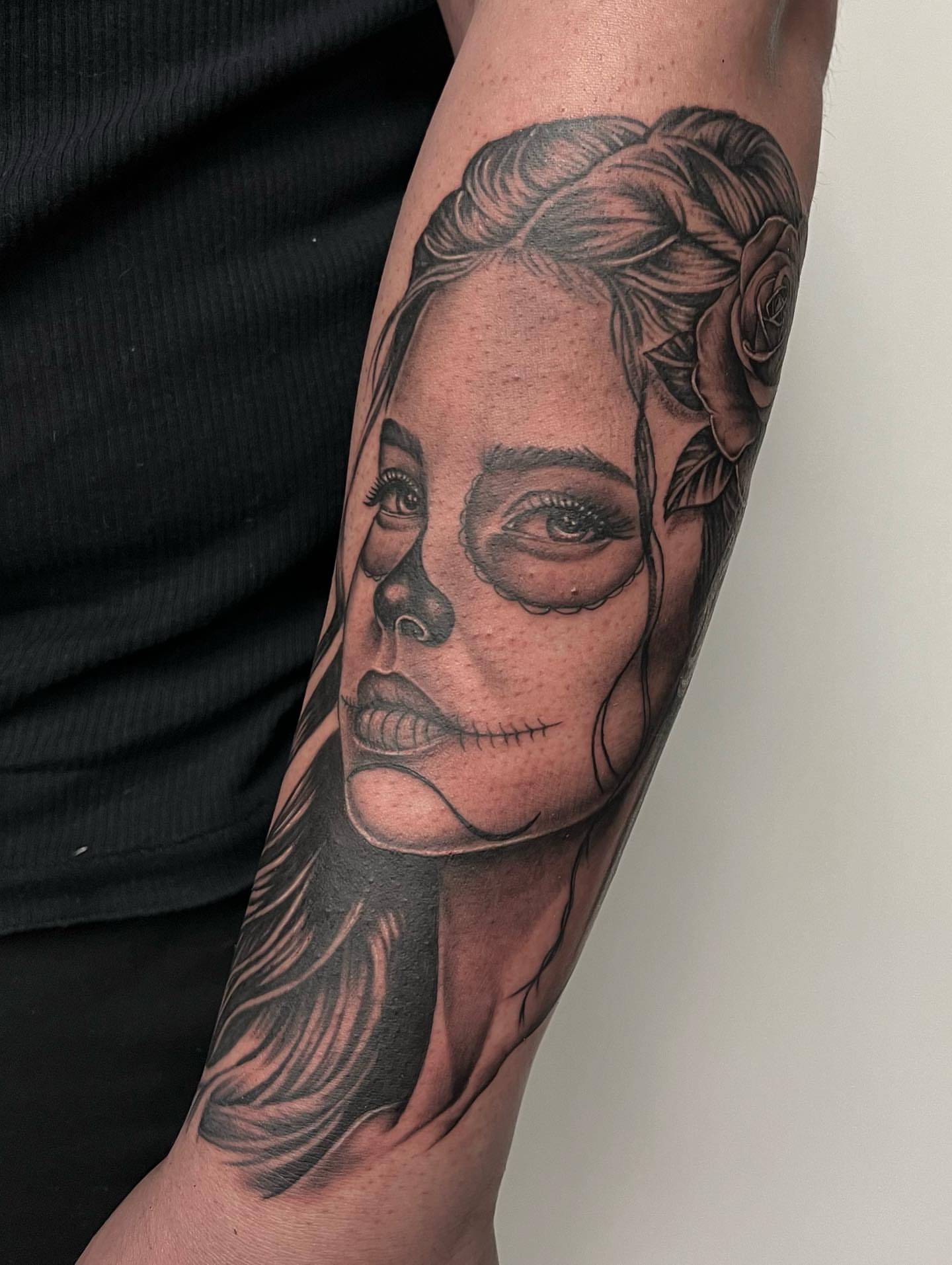 Woman's face realism tattoo on the forearm by Hugo Ruiz-Esparza