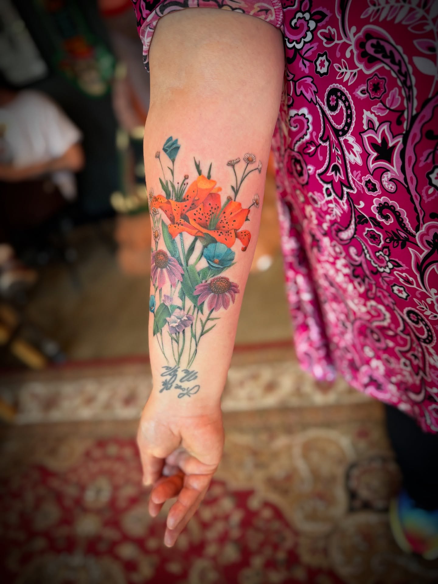 Floral bouquet watercolor tattoo on the forearm by Kbryanttattoos, Ohio City, Ohio