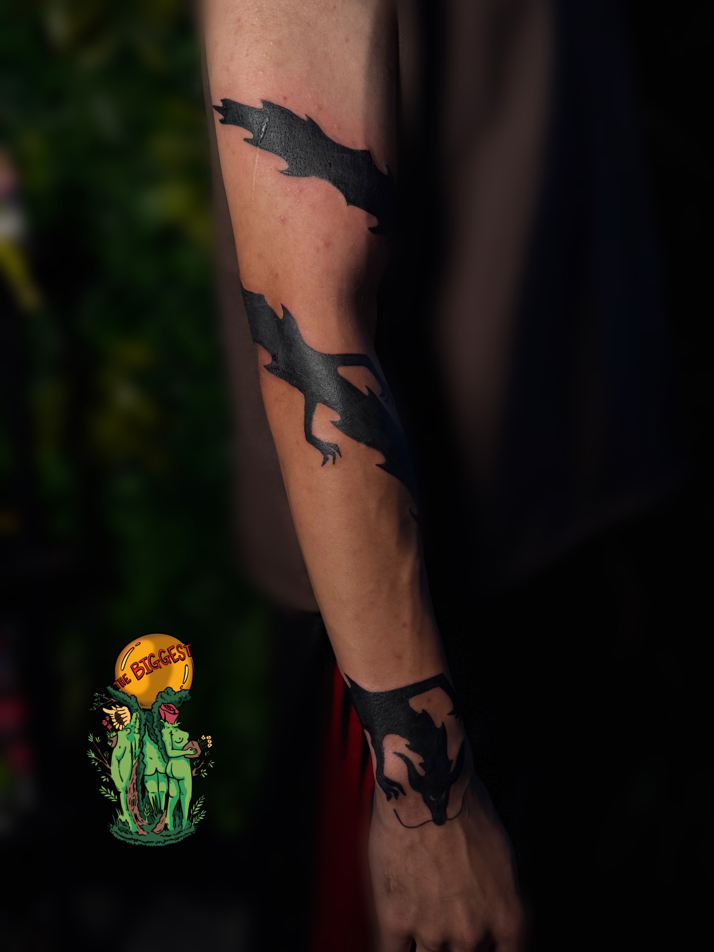 Dragon silhouette tattoo on the forearm by Marques Neal