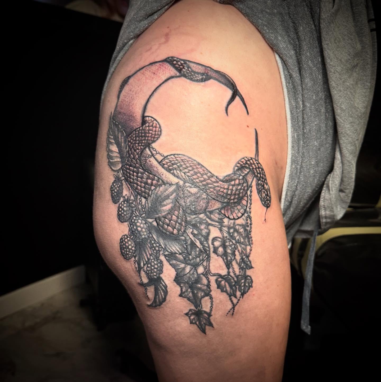 Snake and grapes realism tattoo on the thigh by AaronAdlerTattoos.com, Cincinnati