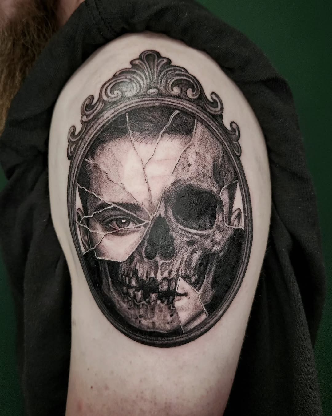 Cracked mirror with skull and eye realism tattoo on the shoulder by Nick de Hoyos