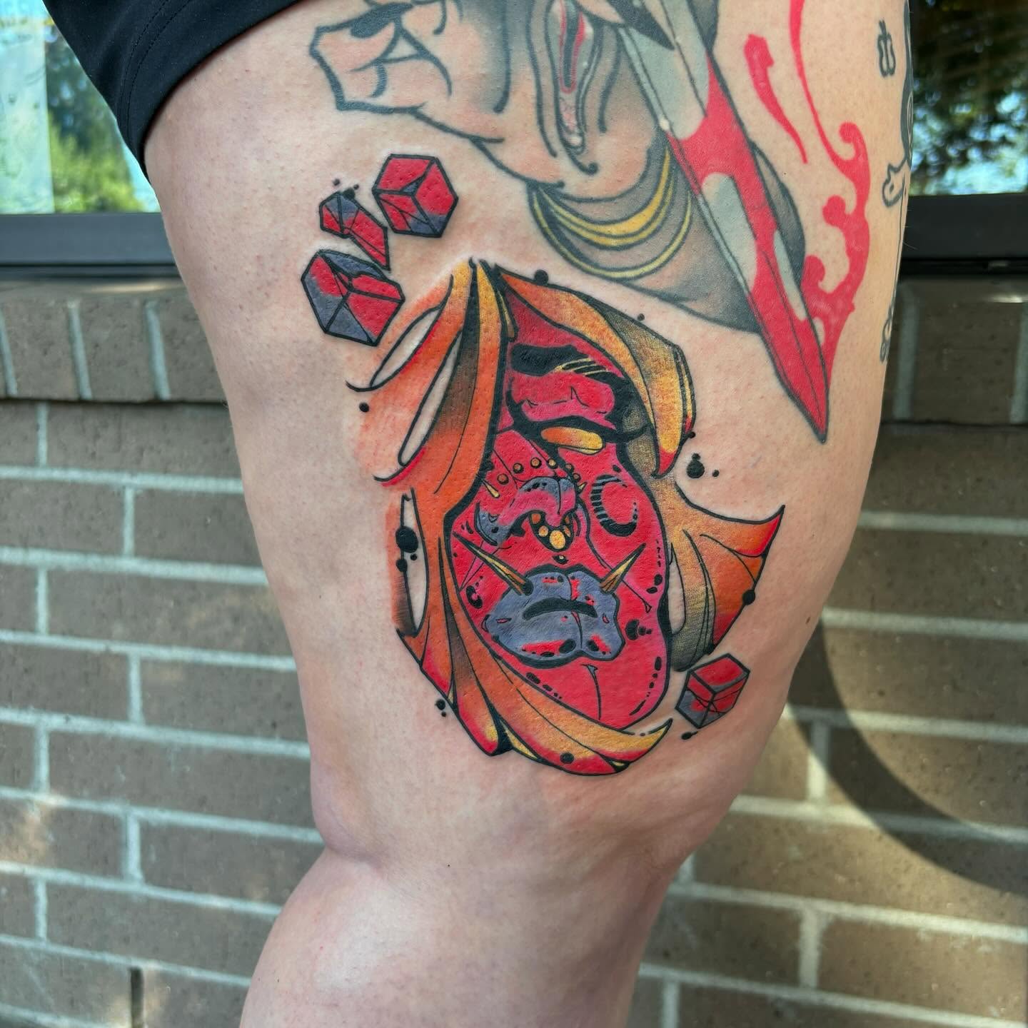 Mask American traditional tattoo on the thigh by Ghost Ham Tattoos