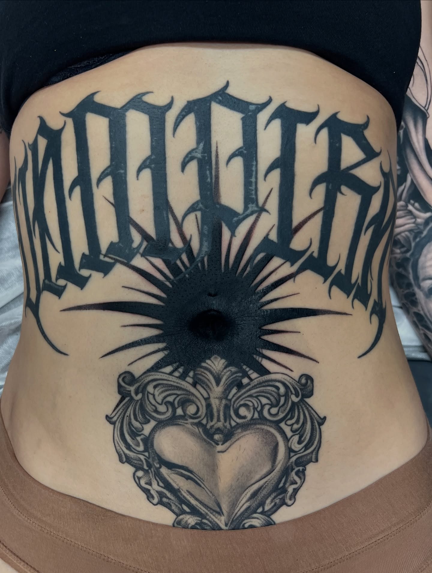 Empire black and grey tattoo on the torso by Emily Jestine Francis