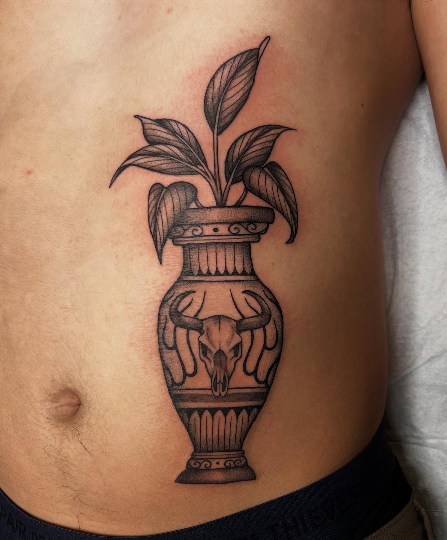 Vase with plant and skull black and grey tattoo on the ribs by Tasha Venola, Bellingham, Washington