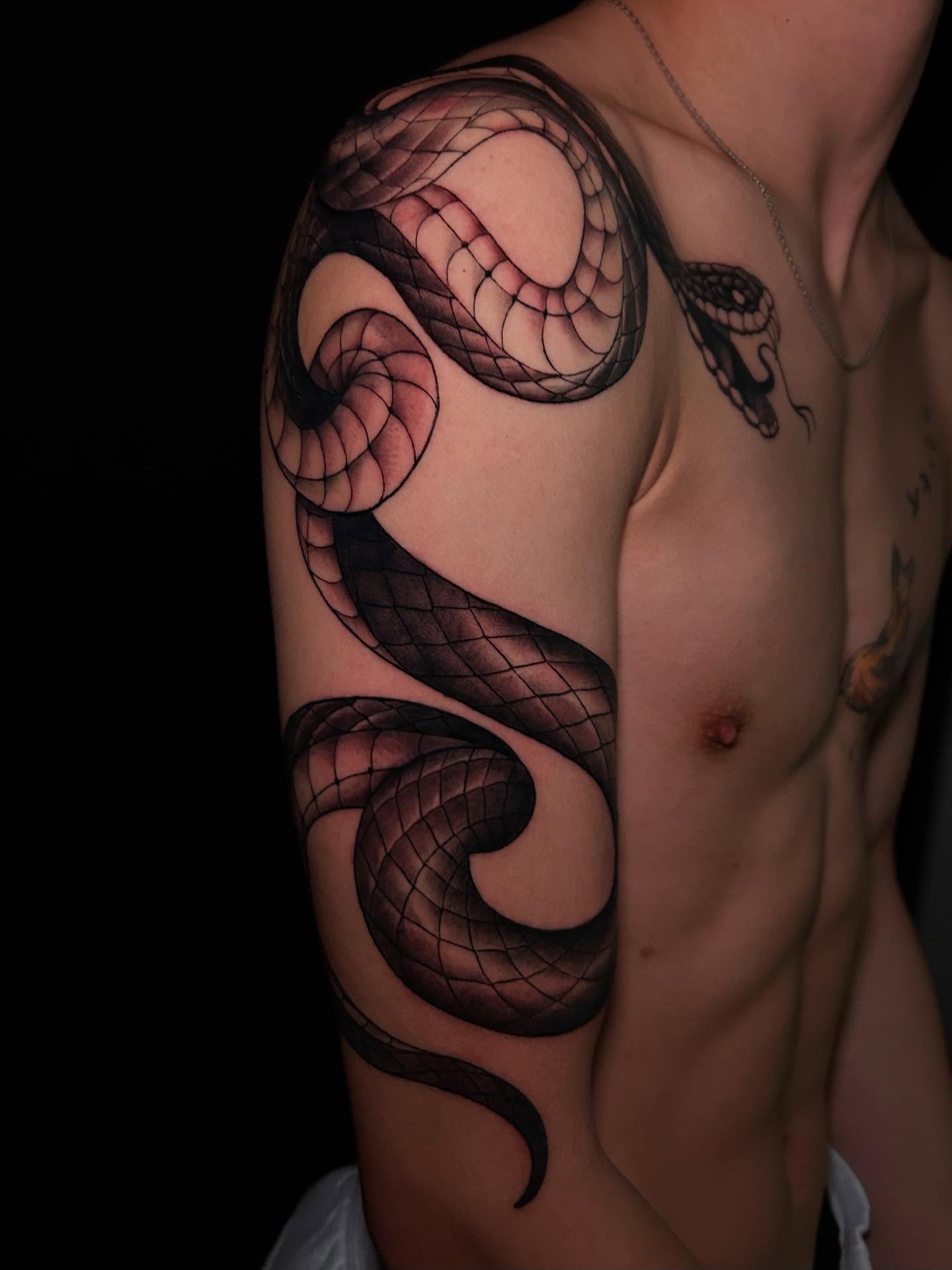 Snake realism tattoo on the shoulder by Chloe