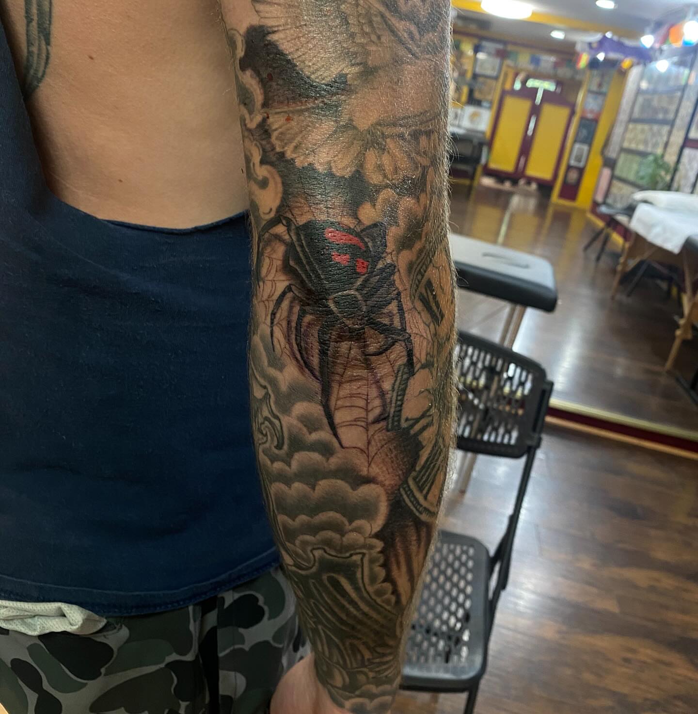 Spider and clouds japanese irezumi tattoo on the forearm by Thomas Cook
