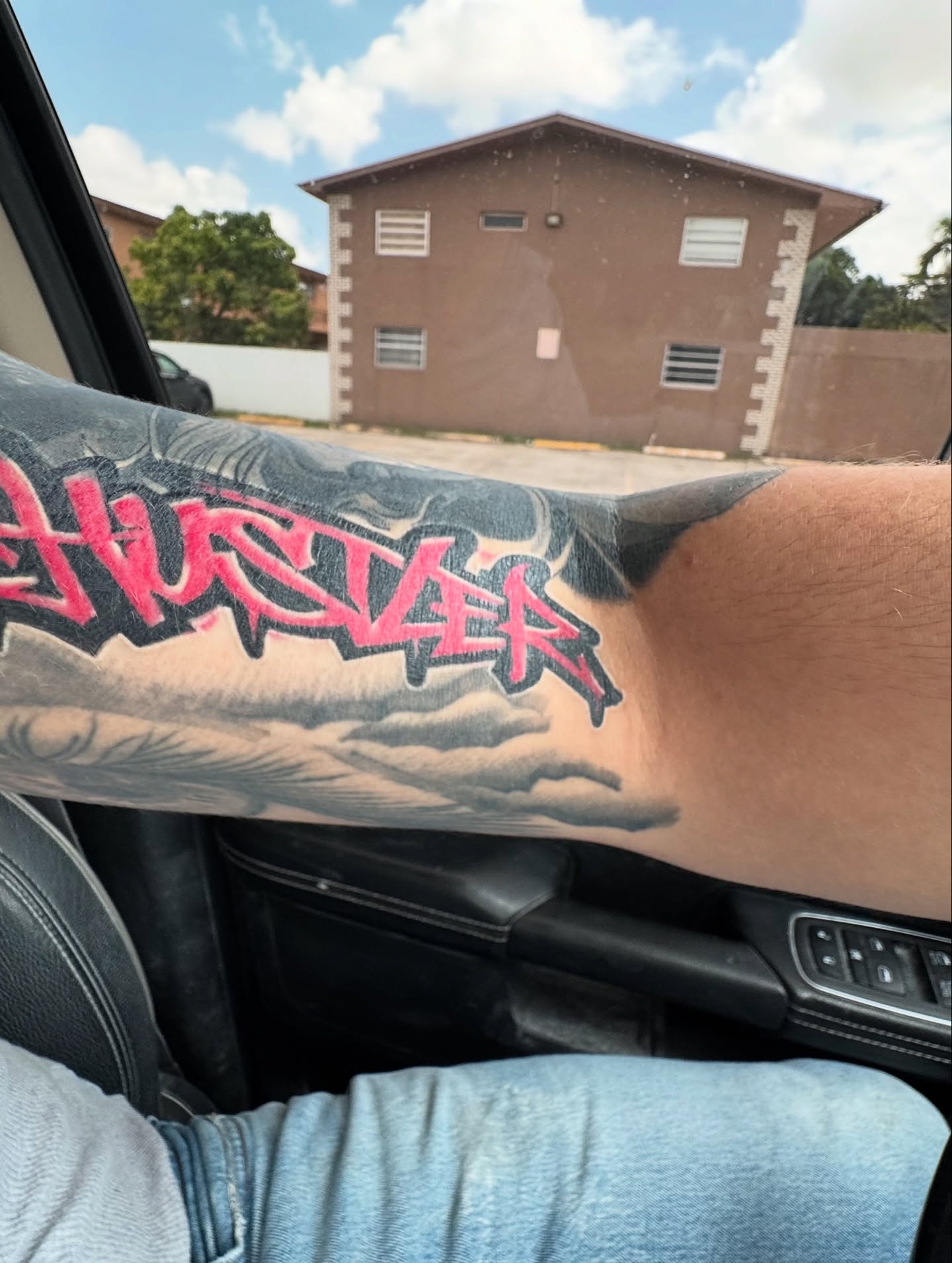 Hustler tattoo on the forearm by Lemaih Gonzalez