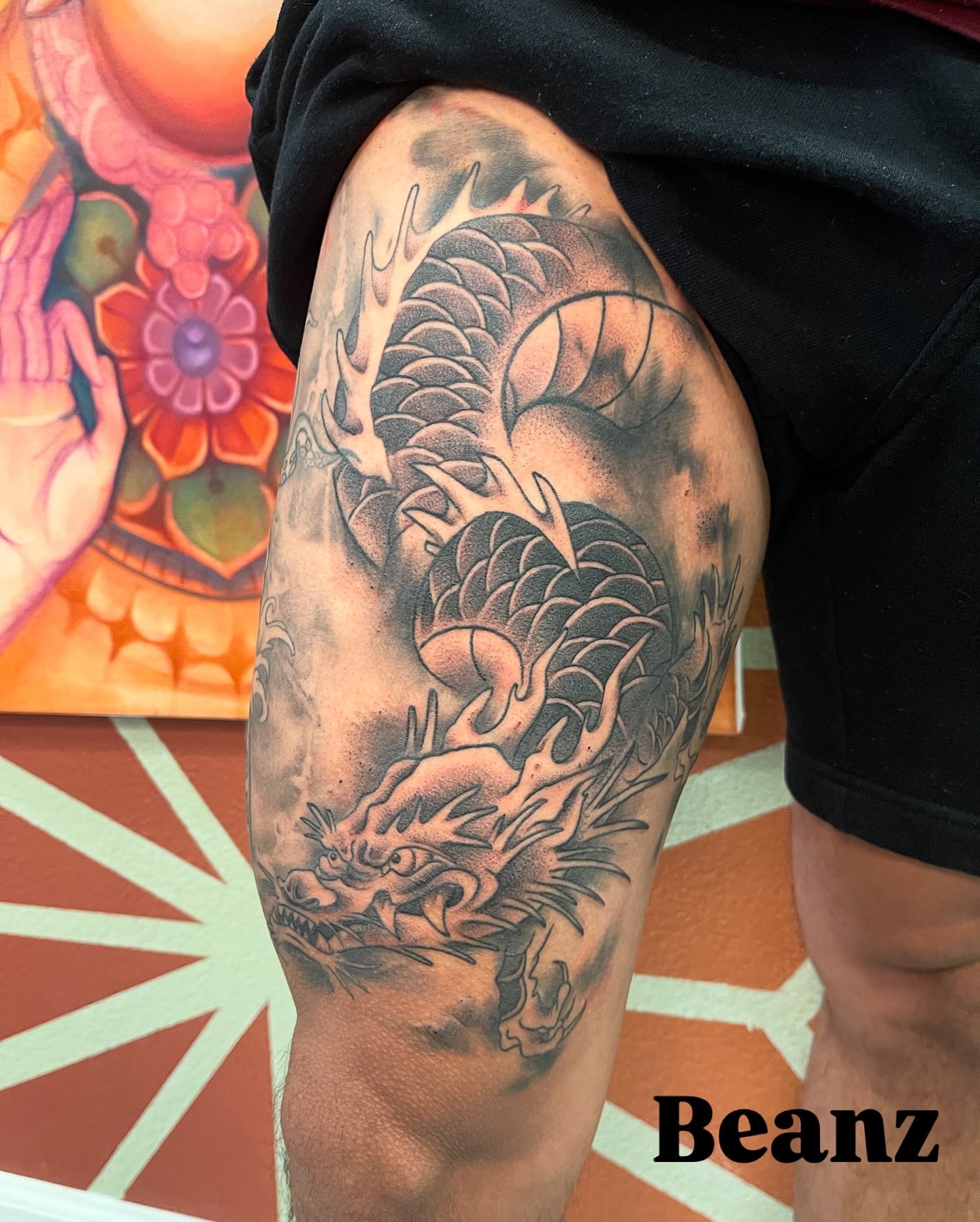 Dragon realism tattoo on the upper arm by Alex