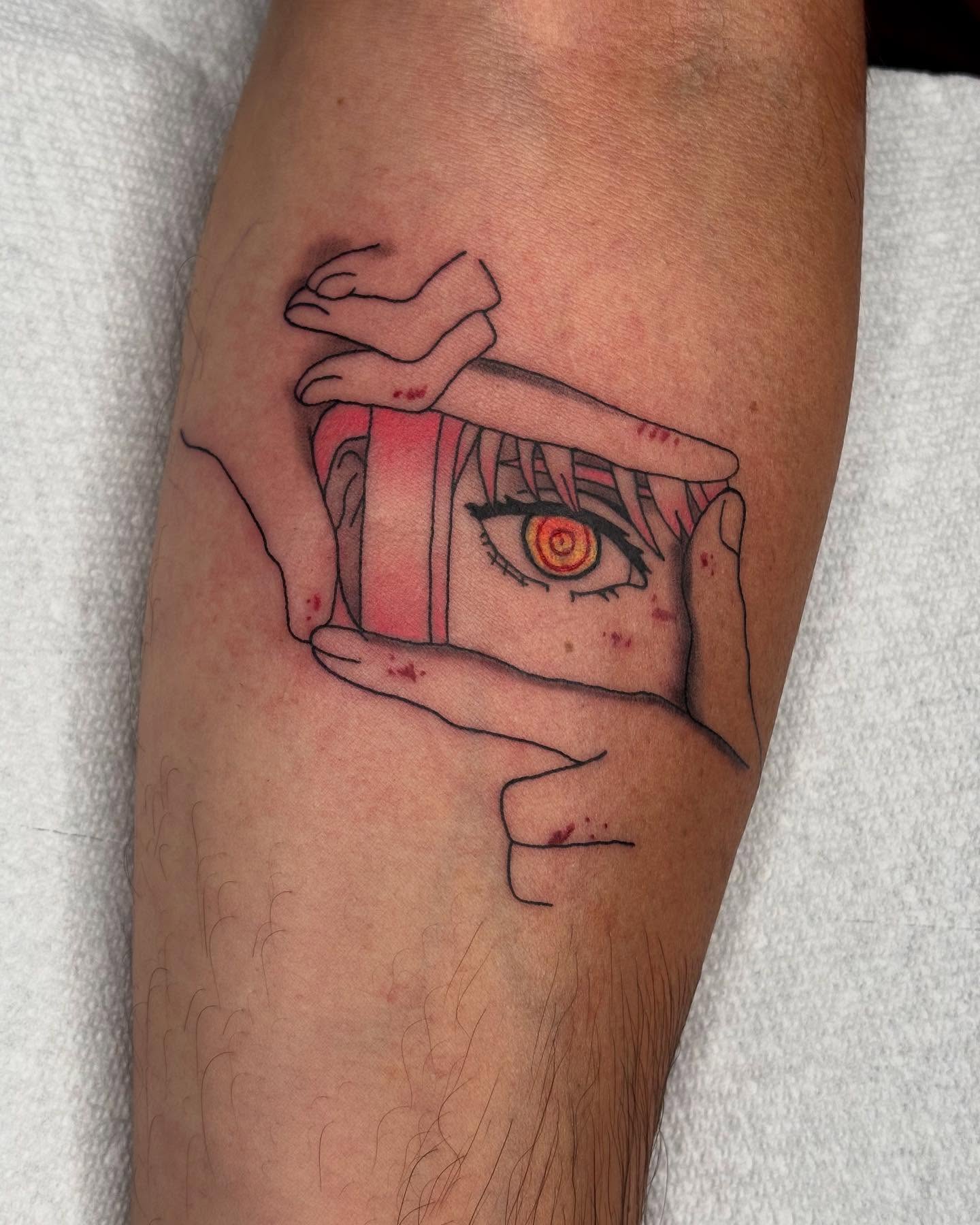 Eye with hands anime tattoo on the forearm by kylie