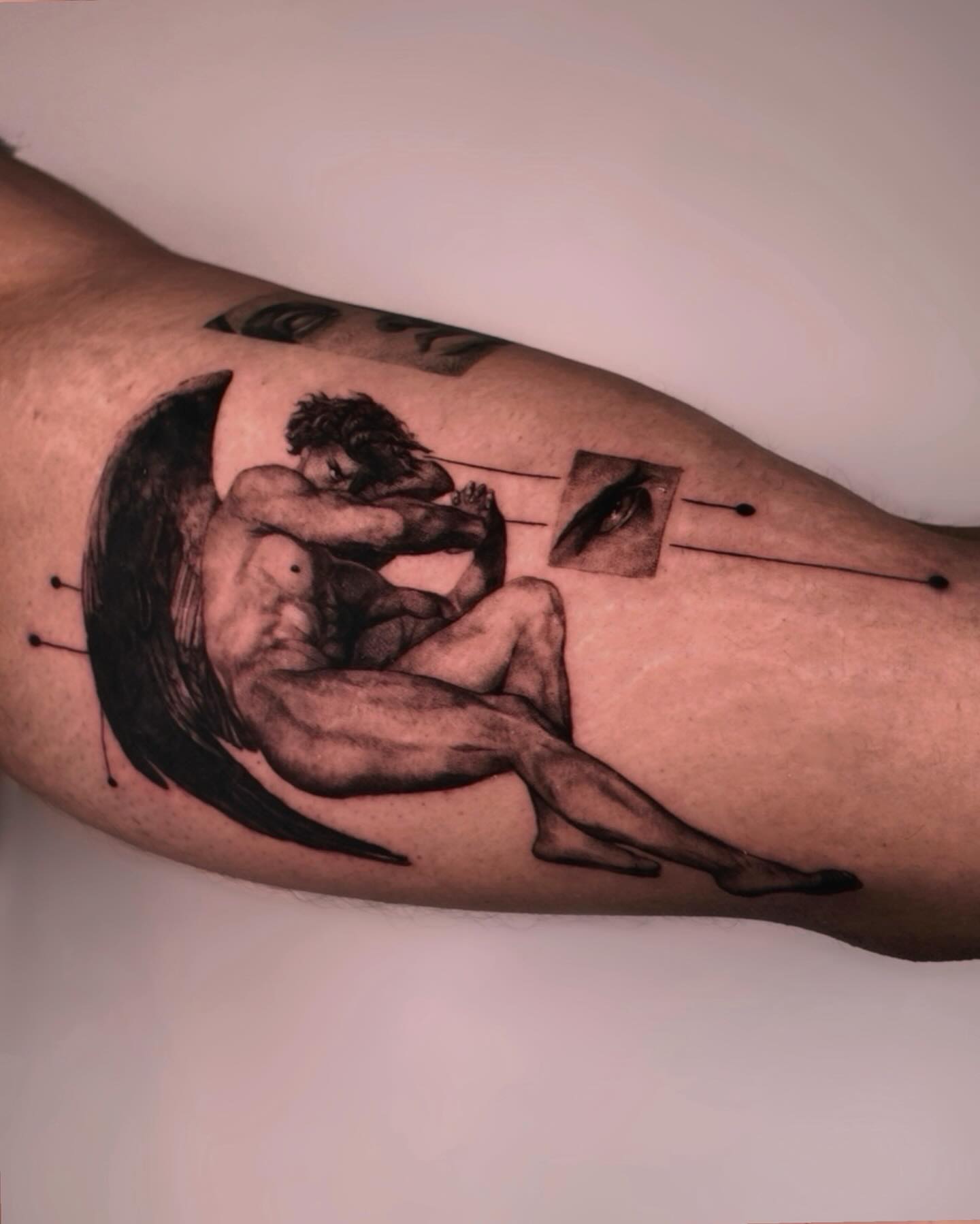 Couple embracing realism tattoo on the forearm by Gabriel