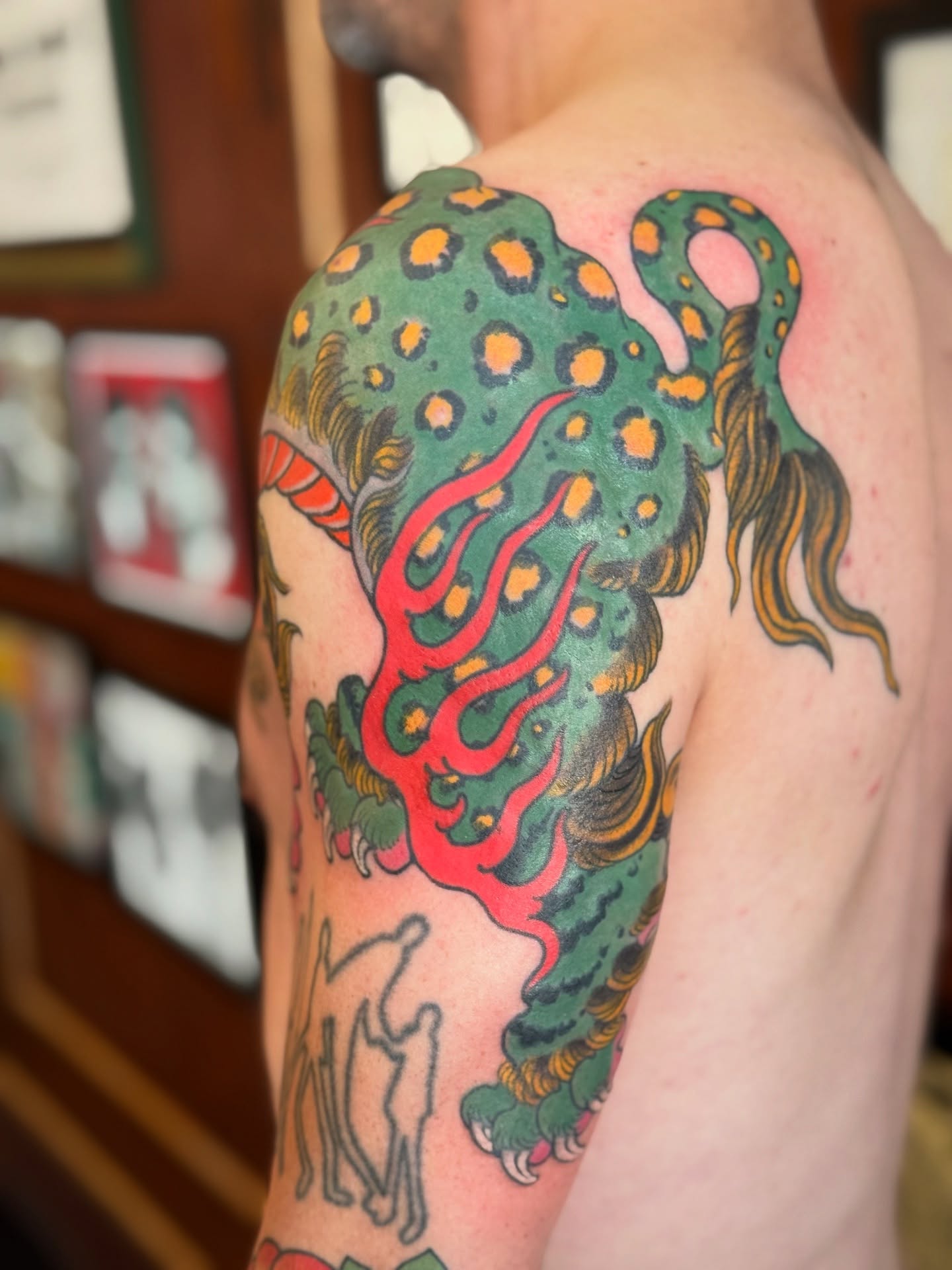 Octopus American traditional tattoo on the shoulder by Candi Kinyōbi