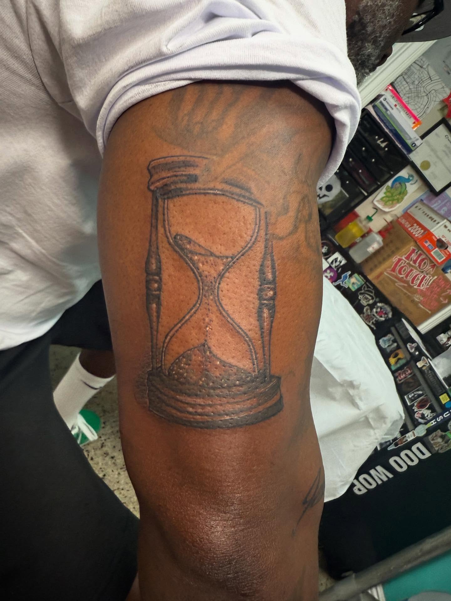 Hourglass black and grey tattoo on the forearm by π΅ππππππ¦π€