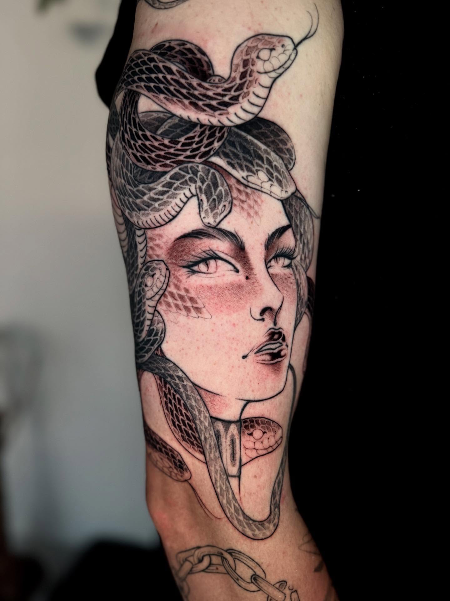 Woman with snakes realism tattoo on the forearm by Angelo Buonanno, Las Vegas, Nevada