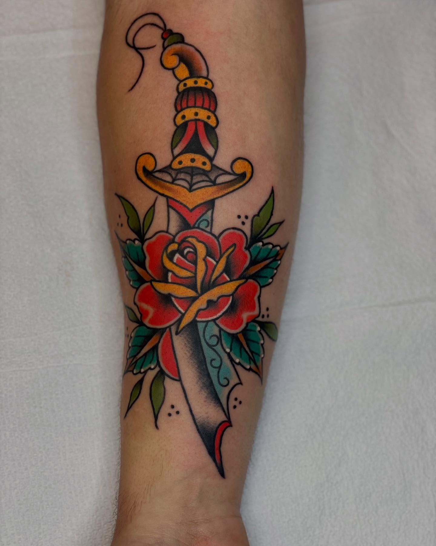 Sword and rose American traditional tattoo on the forearm by Dave Kruseman