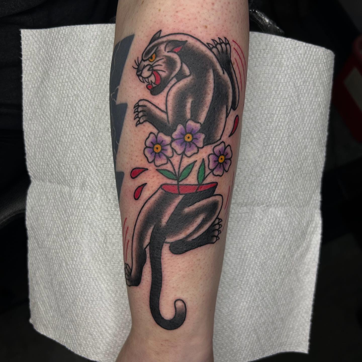 Panther and flowers American traditional tattoo on the forearm by Bregan ✨