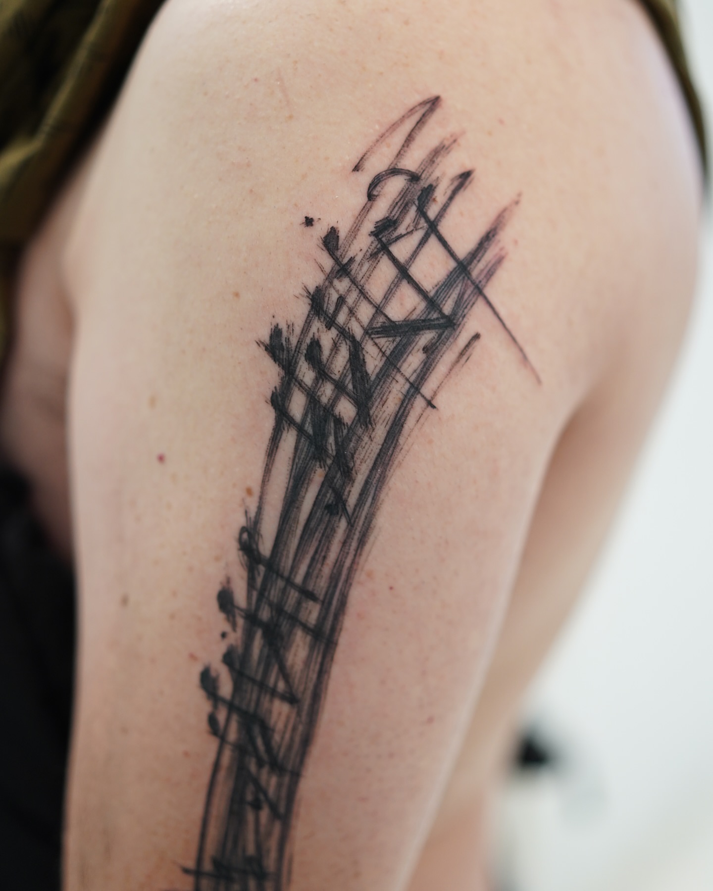 Abstract guitar black and grey tattoo on the shoulder by Young one 영원